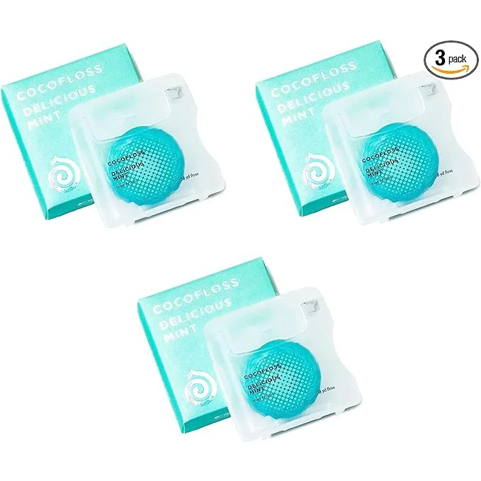 Three packs of Cocofloss dental floss in mint flavor, each with turquoise spools.